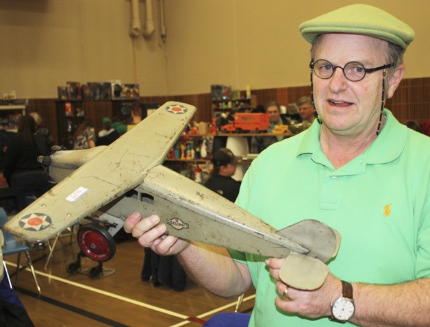 Steve Greso of Stanwood shows his 1920 steelcraft scout plane at the Greater Seattle Toy Show Antique & Collectible Toy Sale at Kent Commons last Saturday.