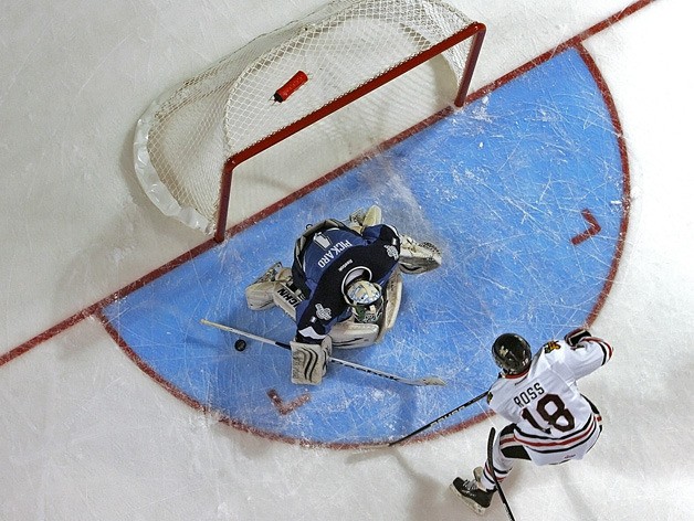 Seattle Thunderbird Calvin Pickard makes a save on Winterhawks' Brad Ross
