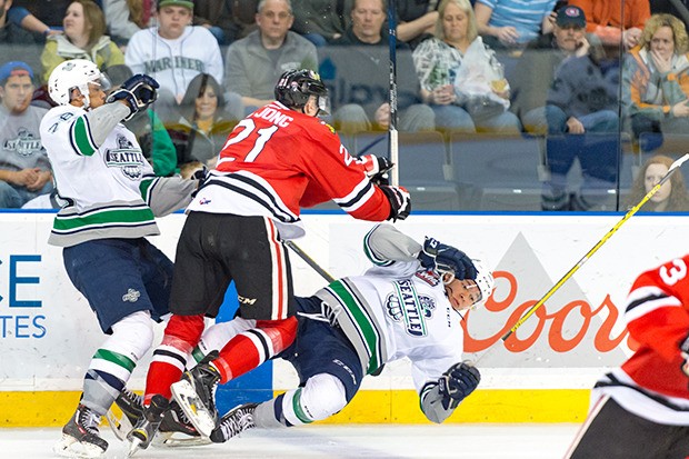 The Winterhawks' Brendan De Jong collides with Keegan Kolesar
