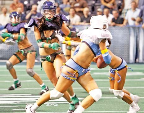 Lindsey Blaine of the Seattle Mist rushes the San Diego Seduction quarterback during the season opener last year. The Mist open this season Aug. 27 against the Los Angeles Temptation at the ShoWare Center in Kent.