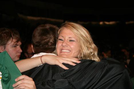 Loriel Jenson hugs Oleg Dovgalyuk following the Kentwood class of 2010 commencement ceremony at the ShoWare Center Saturday evening.