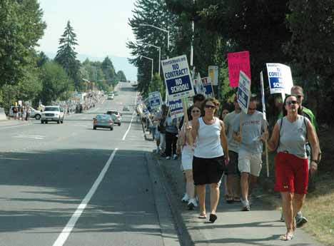 Striking Kent teachers march down 256th Street Friday