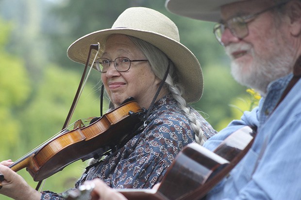 Vivian and Phil Williams of the Washington Old Time Fiddlers Association perform pioneer-day selections at Soos Creek Botanical Garden and Heritage Center last year. The couple will return to perform on Saturday