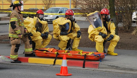 A Kent Fire Department crew responds to a hazardous material spill.