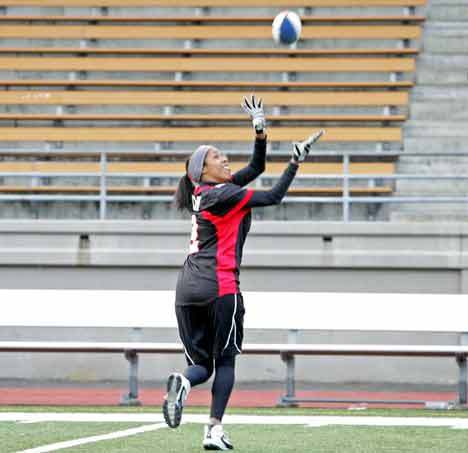 Wide receiver Crystal Brown tracks the ball for a catch  during warm ups Saturday at the Seattle Majestics training camp at French Field in Kent. Based at the field