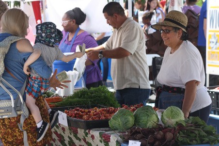 The King County Board of Health decided to delay any decision about an increase in farmers market fees until its January meeting.