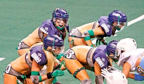 Seattle Mist quarterback Lindsey Blaine leads the team in its Lingerie Football League opener last fall at the ShoWare Center in Kent.