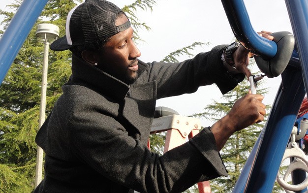 Seattle Seahawks defensive back Marcus Trufant helps construct a playground Dec. 13 at West Fenwick Park in Kent. United Way of King County and the NFL contributed funds for the new equipment.