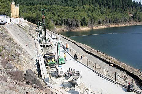 Crews for the U.S. Army Corps of Engineers work to install a grout curtain last year to help slow a leak on the abutment next to the Howard Hanson Dam.