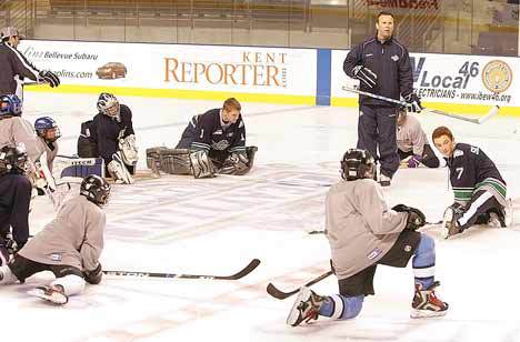 Seattle Thunderbirds coach Rob Sumner discusses his expectations with the players Sept. 15 before practice at the ShoWare Center. The Thunderbirds