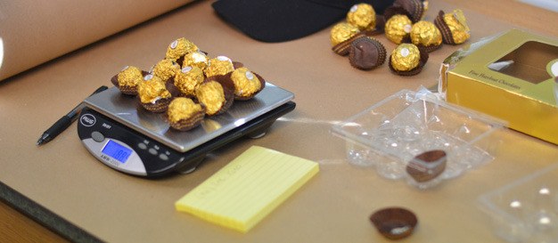 King County Sheriff's Office detectives display drugs disguised as candy that were reportedly mailed from King County to Alaska.