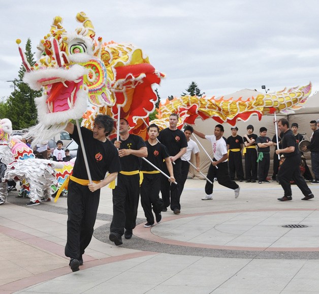 The Kung Fu Lion Dance Team maneuver its Chinese dragon on center stage at the fourth annual Kent International Festival last Saturday.