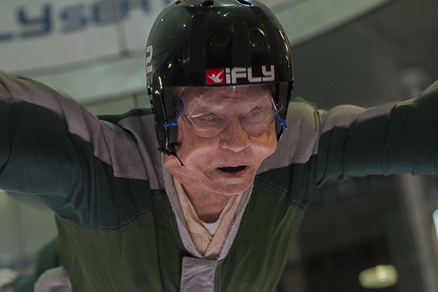 The wind from the tunnel blows Charles Asay’s cheeks high up and apart from his face during his experience at the iFly Indoor Skydiving in Tukwila last Friday. It was the first time in more than 70 years that he had been in a comparable situation.