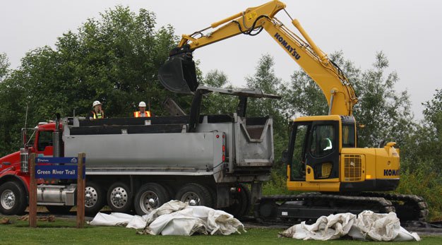Crews have removed all of the giant sandbags that lined the Green River Trail for three years.