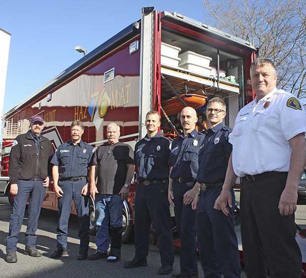 Kent Fire and hazmat team personnel include: from left: Capt. Bob Kelley; Firefighter Neal Houser; mechanic Tom Arnson; Firefighter Geoff Emly; Capt. Jeff Barsness; Firefighter David Frazier; and Kevin Garling