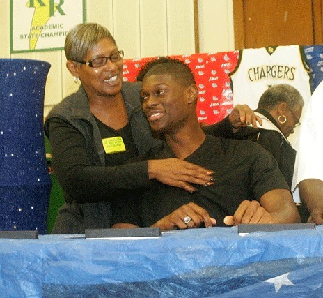 Kentridge High's Gary Bell gets a big hug from his aunt