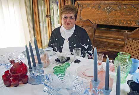 Kent’s Kay Larsson displays samples of Depression Era glass similar to those that can be found at this year’s Green River Glass Show and Sale. The event takes place Feb. 27 at the Kent Commons.