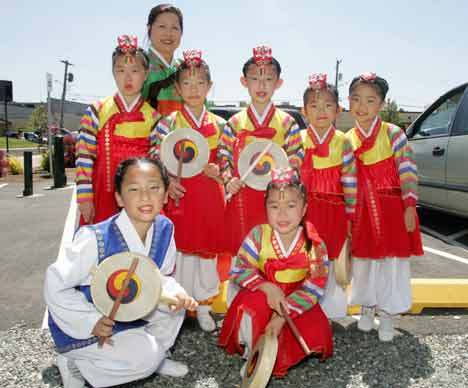 The Northwest Korean Art Center performed June 27 at the first Kent International Festival. Standing from left are Serahina Kuton