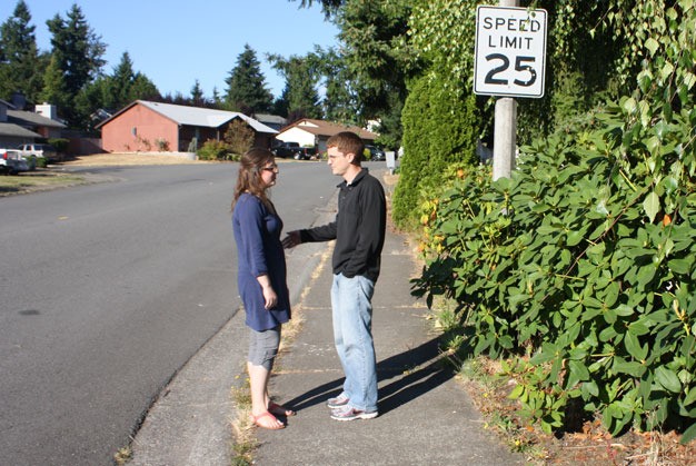 Matt and Allison Richner discuss the problems with speeding vehicles through their Kent neighborhood along Southeast 223rd Drive in Panther Lake.
