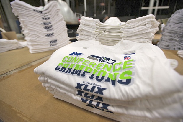 NFC champions T-Shirts lie stacked and awaiting boxes at Kent's Polar Graphics