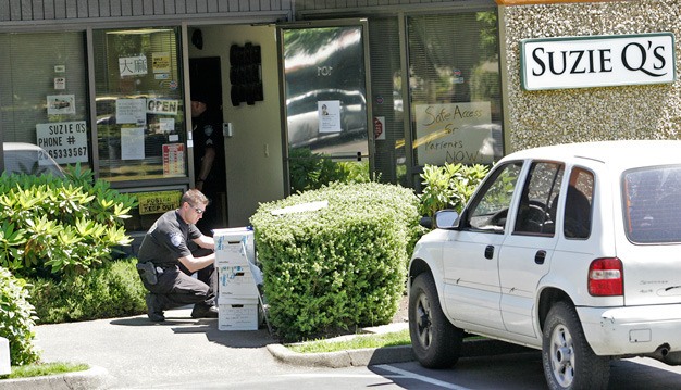 Kent Police search through Suzie Q's and Sun Leaf Medial Center to collect evidence for medicinal marijuana July 6.  The warrents are the city’s latest step in a process that began with notice to marijuana dispensary owners they must close or face the loss of their business licenses and potential criminal charges.