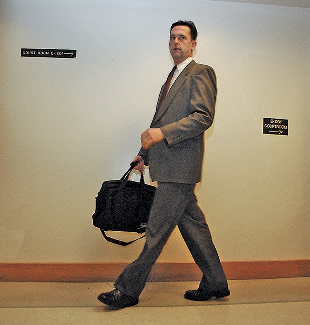 Public defender Mark Prothero leaves the courtroom after Gary Ridgway’s arraignment at the King County Courthouse in Seattle in 2003. The Kent attorney Prothero brokered a plea deal that spared Ridgway the death penalty in exchange for the Auburn man confessing to 49 counts of aggravated murder.