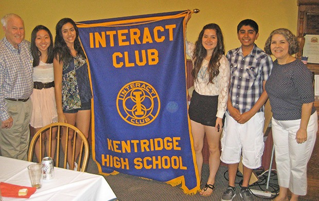 The Kent Rotary Club presents a banner to the Kentridge High School Interact Club on Tuesday. The club was officially chartered on June 4. From left: Rotarian Ron Harmon
