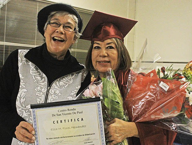 Mayor Suzette Cooke celebrates Elvia Flores’ achievements at the recent Centro Rendu graduation ceremony.
