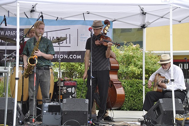 Ranger and the “Re-Arrangers” perform gypsy jazz and swing music on Tuesday afternoon at Kent Station as a part of Kent’s Summer Concert Series. The free summer concerts provide 24 opportunities to enjoy live performances in outdoor settings. Concerts and performances for kids are held Wednesdays at noon at Town Square Park. Adults and families can enjoy their favorite types of tunes on Tuesdays at noon at and on Wednesday evenings at Kent station. Thursday evenings musical acts take the stage at Lake Meridian Park. The series runs through Aug. 18. For more information and a list of performers