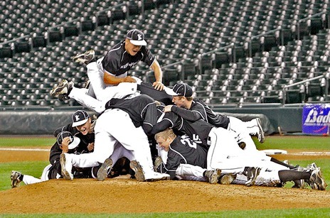 Kentwood players dogpile onto the mound moments after knocking off Richland 8-0 for the Class 4A state championship last spring.