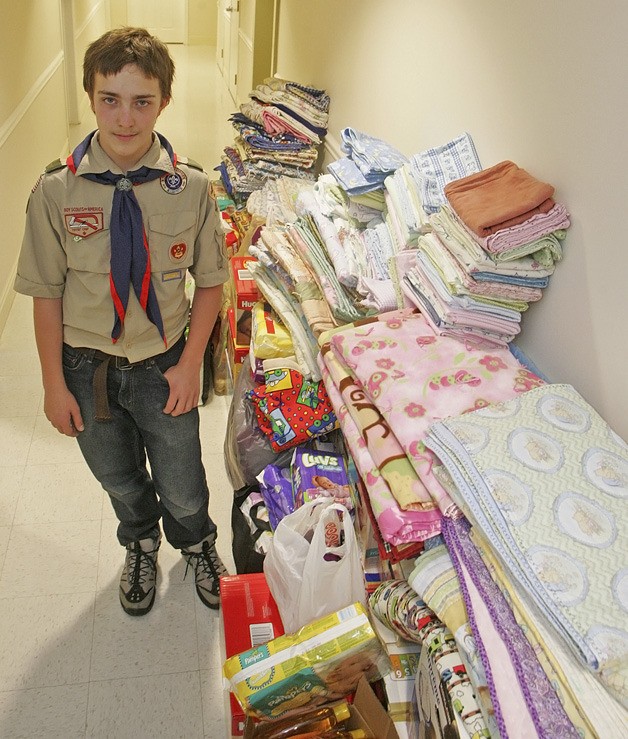 Eagle scout applicant David Kelley poses with his donation for Pediatric Interim Care Center