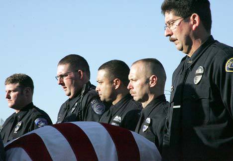 Emotional moment: Law officers operated as pallbearers Dec. 8 for the casket of Lakewood officer Greg Richards