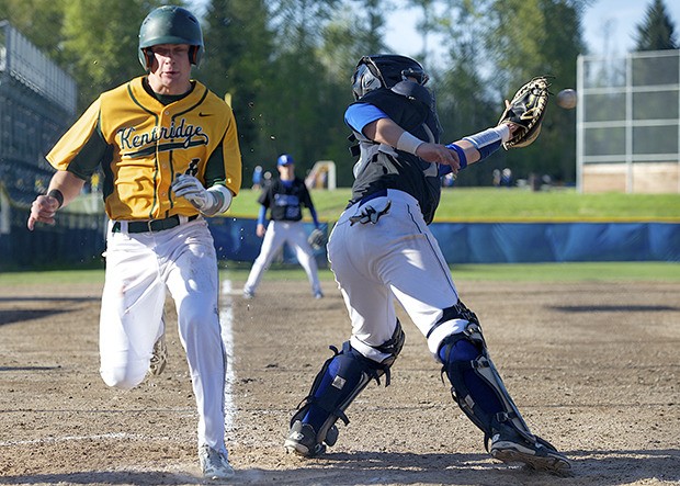 Kentridge center fielder Carter Johnson picks up another run for the Chargers during a 19-5 stomping  of Tahoma on Monday in SPSL North play.