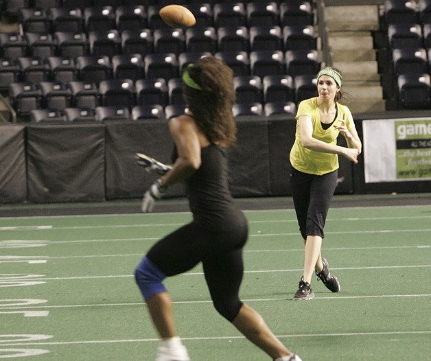 Seattle Mist quarterback Angela Rypien sends the ball up field Tuesday