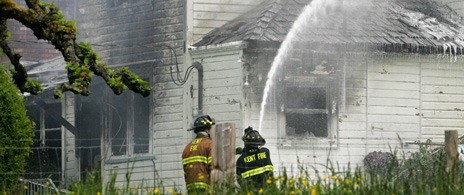 Kent firefighters battle a blaze two years ago on the East Hill.