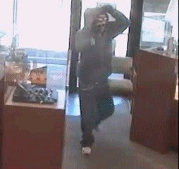 A masked man armed with a handgun enters Bonaci Fine Jewelers in Kent on the morning of May 4.