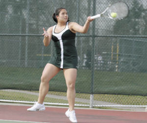 Kentridge junior Kim Quach lets fly with a forehand during last Thursday’s match against Kentwood. Quach and Anna McIntosh came from behind to win No. 1 doubles