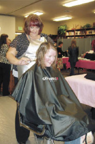 Jenni Marshall of Victoria Roberts Salon and Spa gives Stephanie Zegers a new look April 14 during the Glizty Gals Spa Night at Faith Baptist Church.