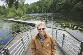 City of Kent environmental biologist Matt Knox stands on boardwalks at Lake Fenwick in Kent