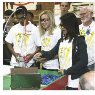 Lindbergh High School hosted the Northwest Regional Robotics Competition May 29. The robots had to pick up pingpong balls and place them in a dish to score goals. Above (left to right): Lindbergh’s Jawinder Kahlon