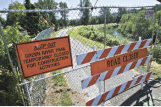 The Green River Trail is blocked by a fence near Russell Road and James Street in Kent Friday