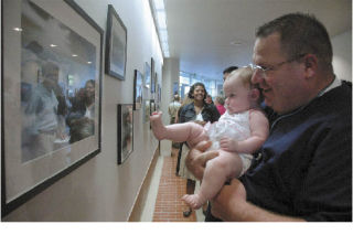 Maple Valley resident Sean Connolly shows daughter Kate