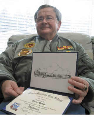 Vietnam War veteran Terry Hague displays the Kent-Meridian High School diploma he recently received along with the Class of 2008.