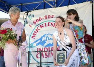 Mayor Suzette Cooke gets a chuckle as Cornucopia Days 2007 queen Erin Sheldon presents the 2008 queen Nicole Oliver with her crown during Friday’s coronation.