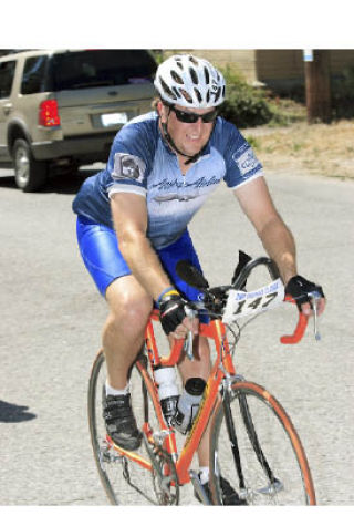 Craig Davidson rides in last year’s John L. Scott Foundation Courage Classic Bicycle Tour