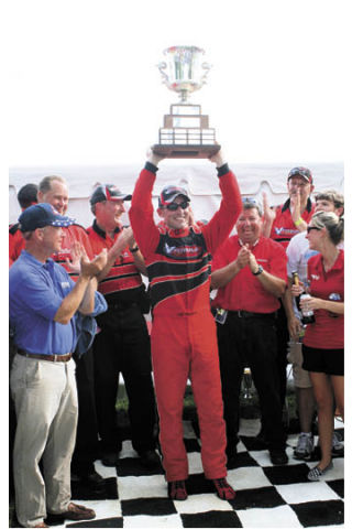 Jeff Bernard of Kent hoists the trophy after winning the Governor’s Cup regatta last month in Madison