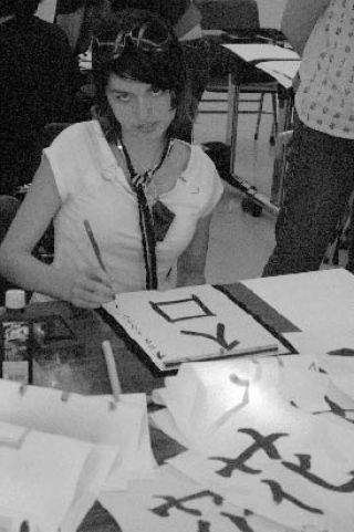 Kentlake High School student Trinity Smith practices her calligraphy during a cultural-exchange trip this month to Japan.