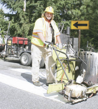 Tom Rusbuldt is a sign-maintenance worker for the city of Kent. “You don’t get bored