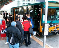 Metro Transit riders board the bus in this file photo from King County.
