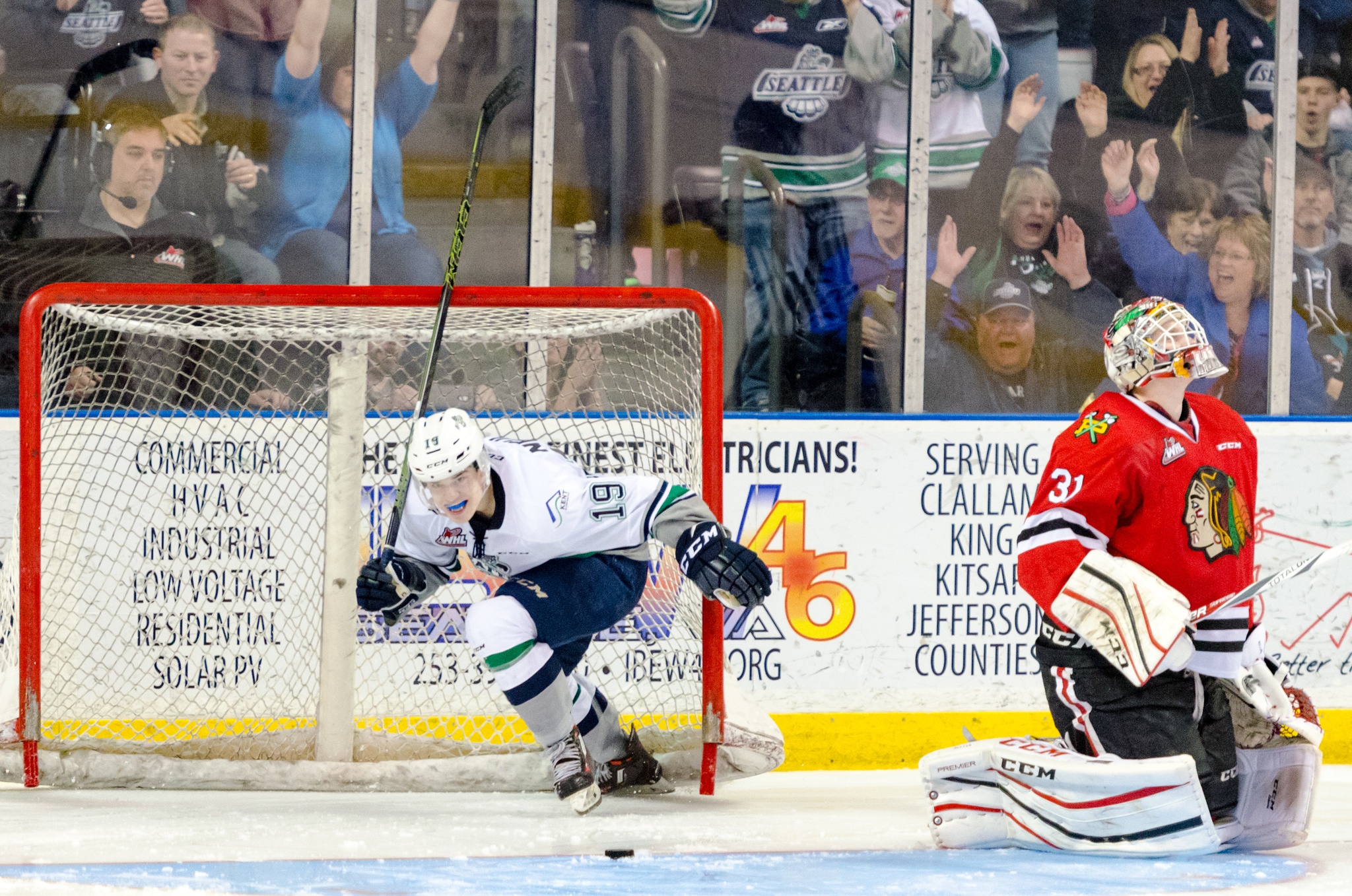 The Thunderbirds’ Donovan Neuls scores on Winterhawks goalie Cole Kehler during WHL action on March 19. Seattle came back from a three-goal deficit in front of a sellout crowd of 6